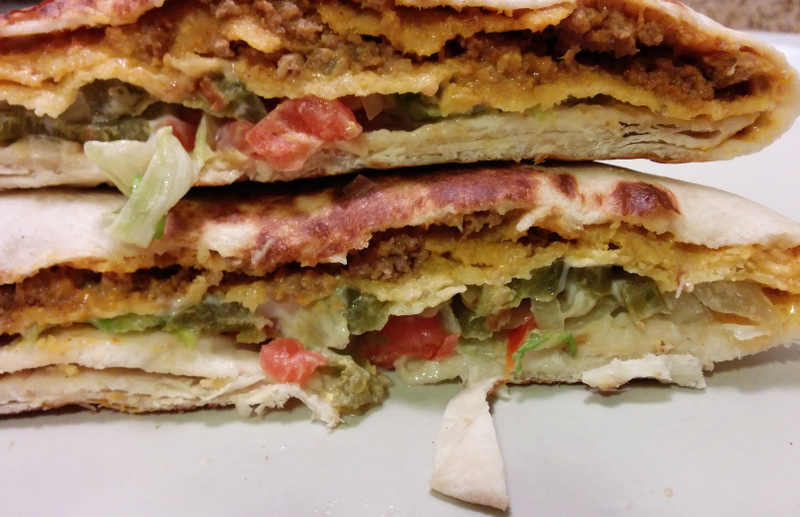 Illustration for article titled SnackTAYku: Taco Bell's Triple Double Crunchwrap Is 2 or 3 Times As Good As the Regular Kind